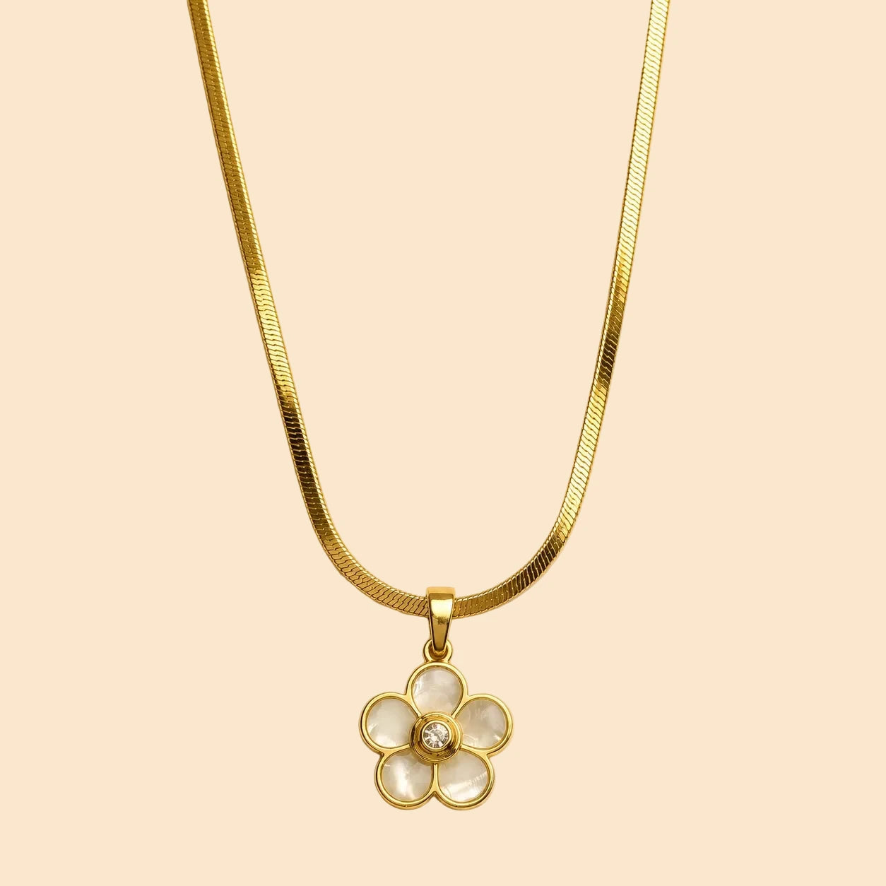Gold necklace with a floral pendant