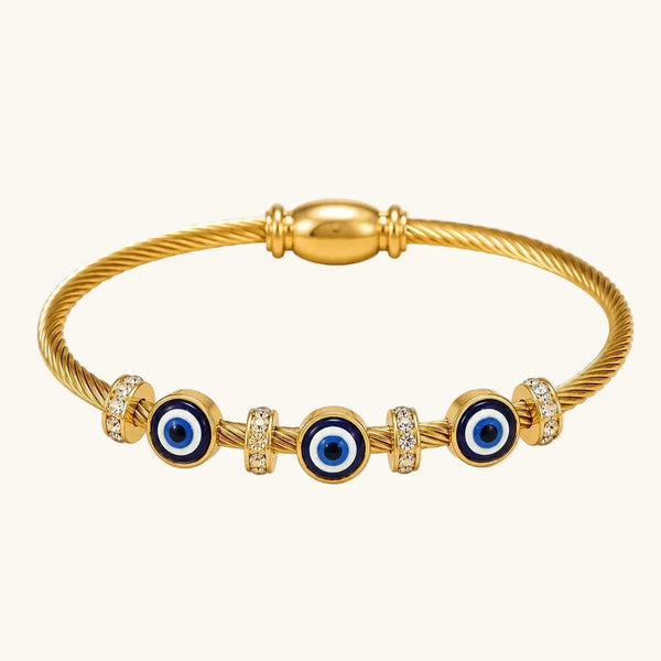 Gold twisted cable bangle bracelet with three blue evil eye charms and CZ rondelle spacers