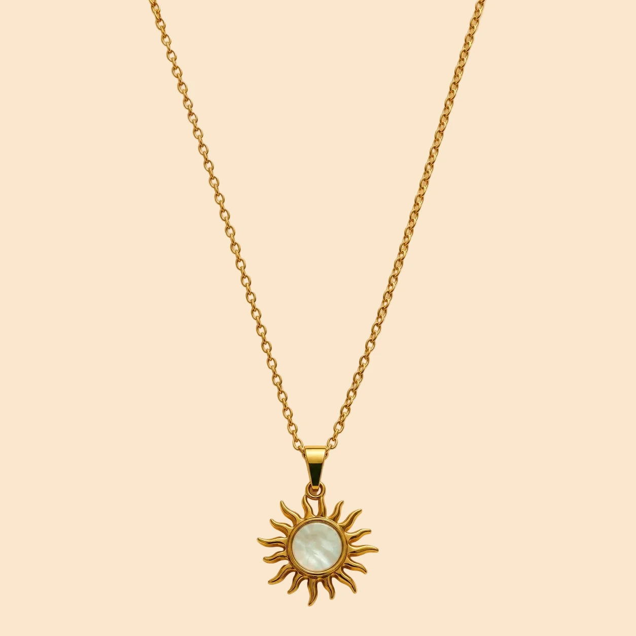 Gold necklace with a sun-shaped pendant 