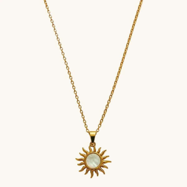 Gold necklace with a sun-shaped pendant 