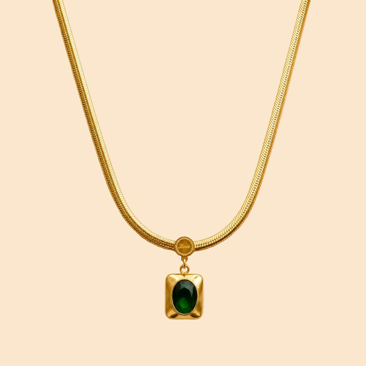 Gold necklace with a green emerald stone pendant